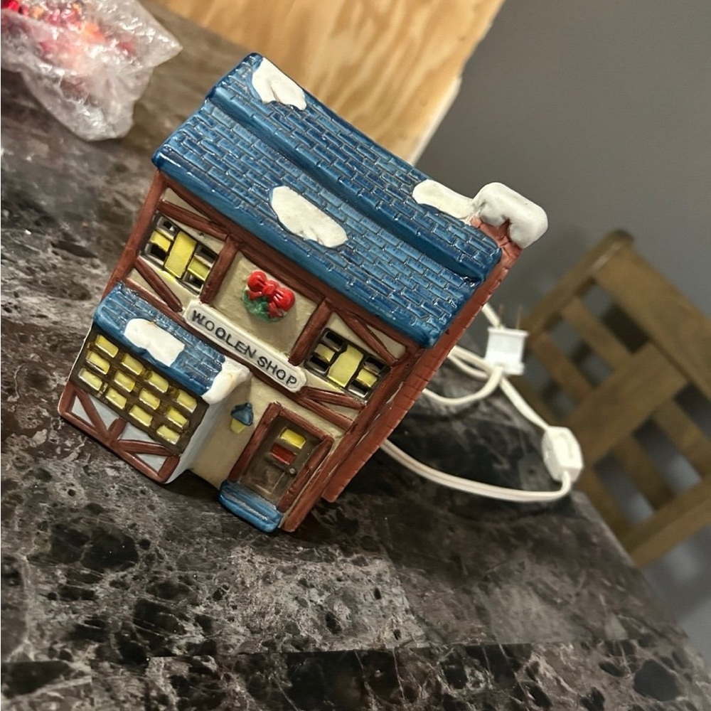 Department 56 Woolen Shop with Blue Roof and Red Accents
